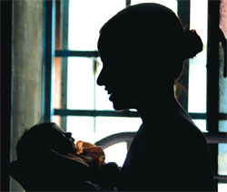 Happiness Arrives: Sunita with her newborn son in her hospital ward