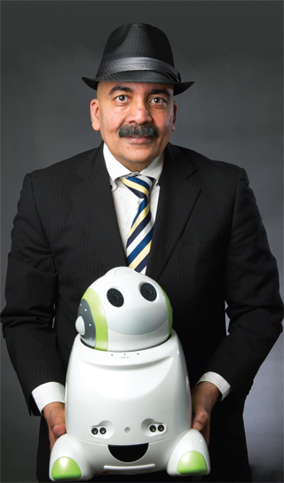 Father and son Rajiv Khosla with Charlie, from the PaPeRo family of Communication Robots